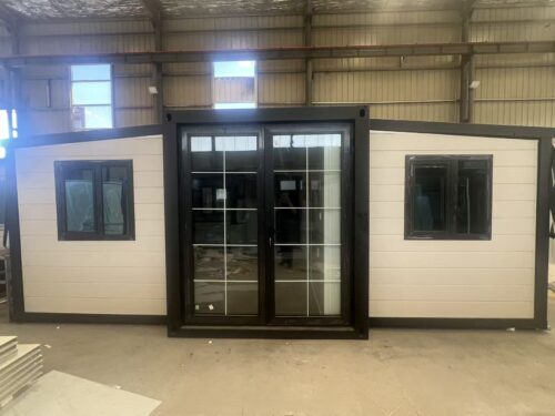 20-foot double-wing folding room with white carved-panel exterior wall
